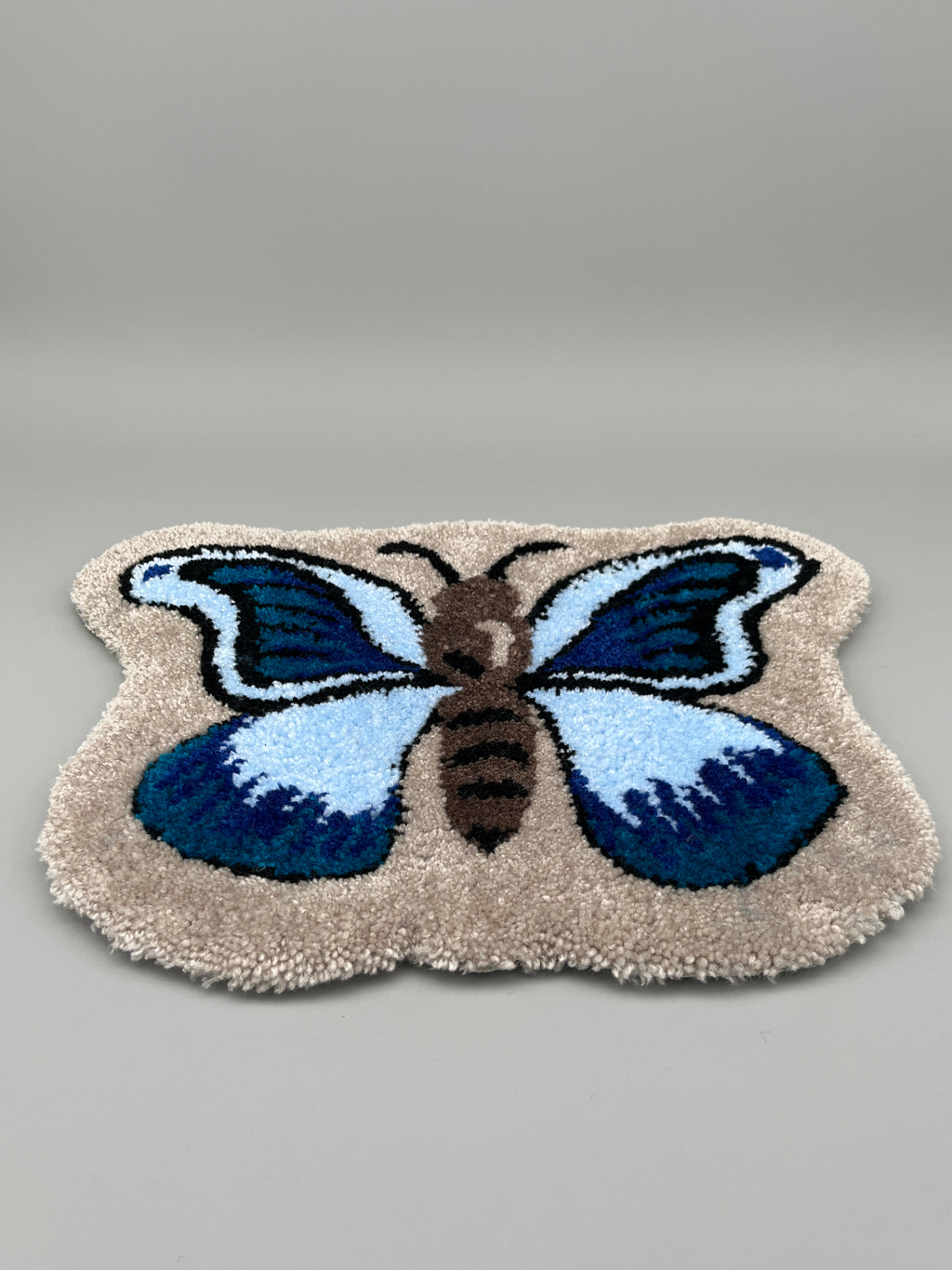 Handgefertigter Teppich, Schmetterling