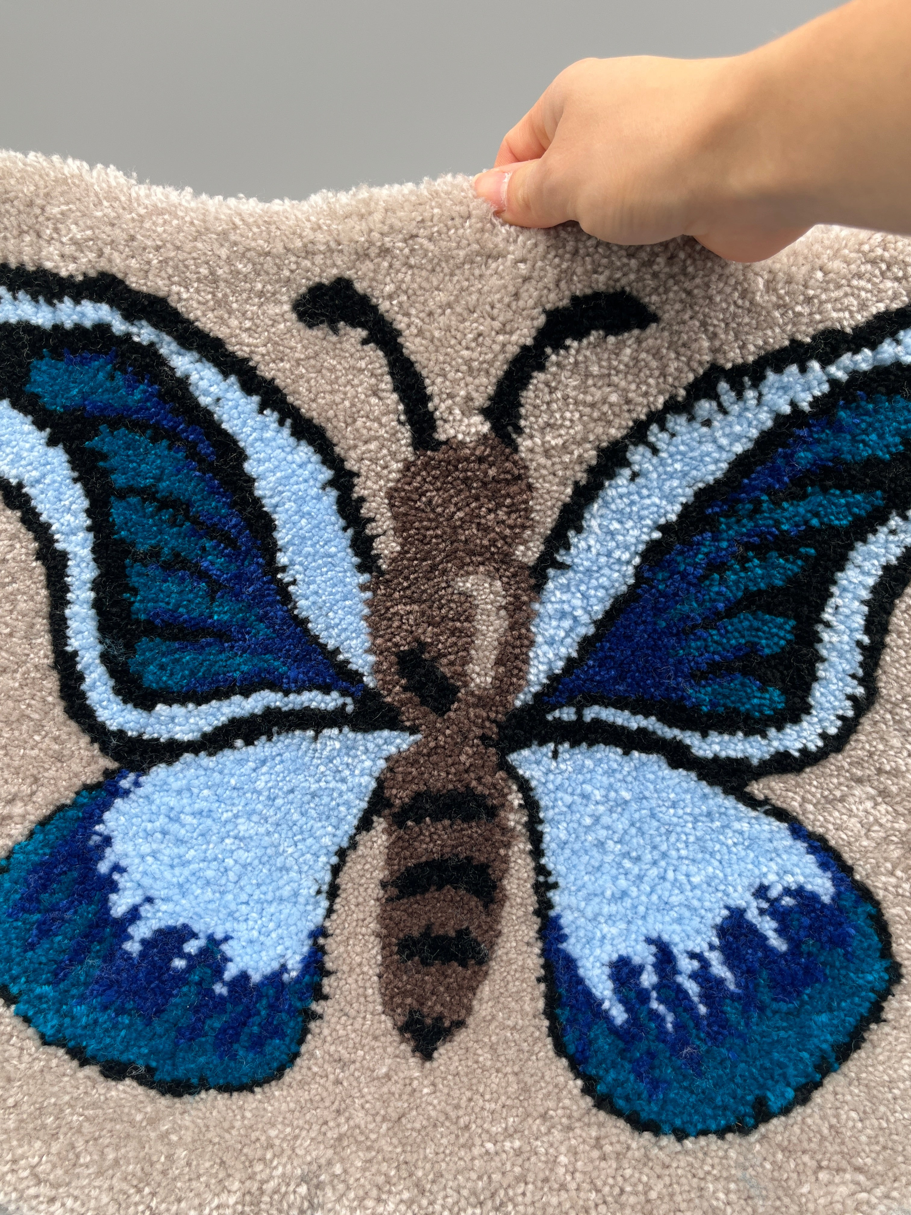 Handgefertigter Teppich, Schmetterling