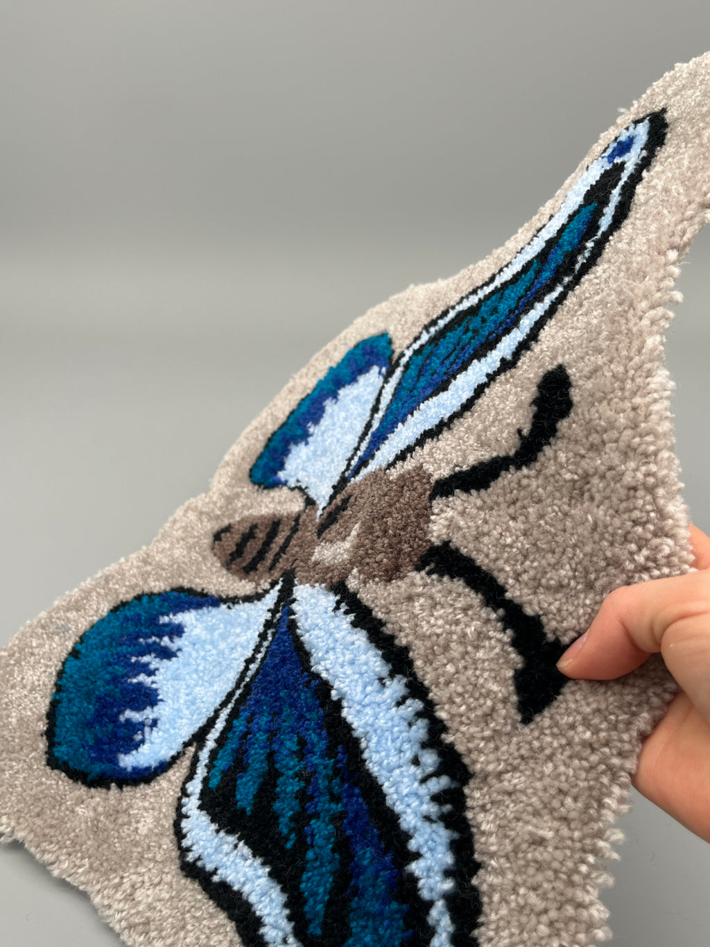Handgefertigter Teppich, Schmetterling