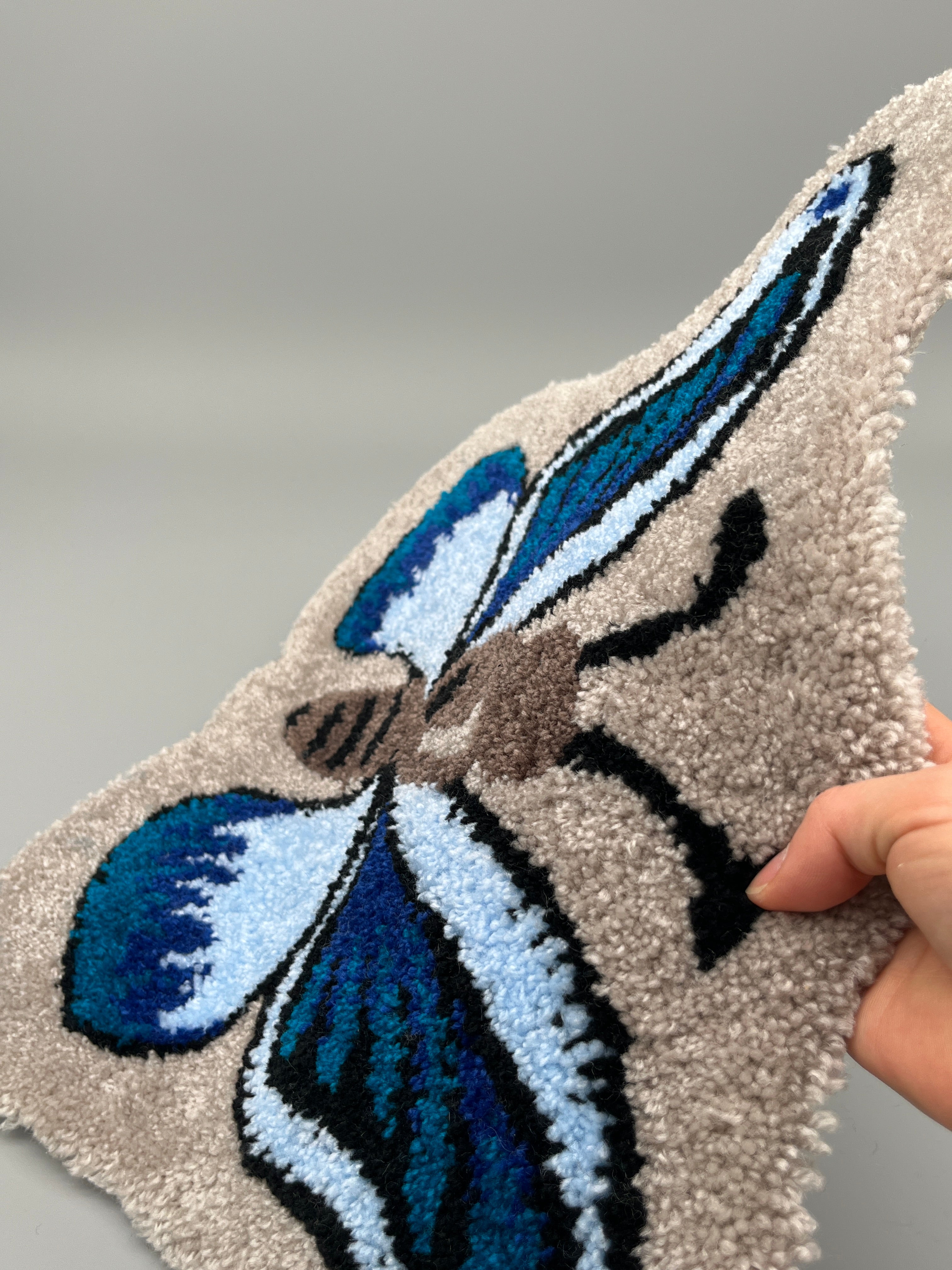 Handgefertigter Teppich, Schmetterling
