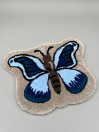 Handgefertigter Teppich, Schmetterling