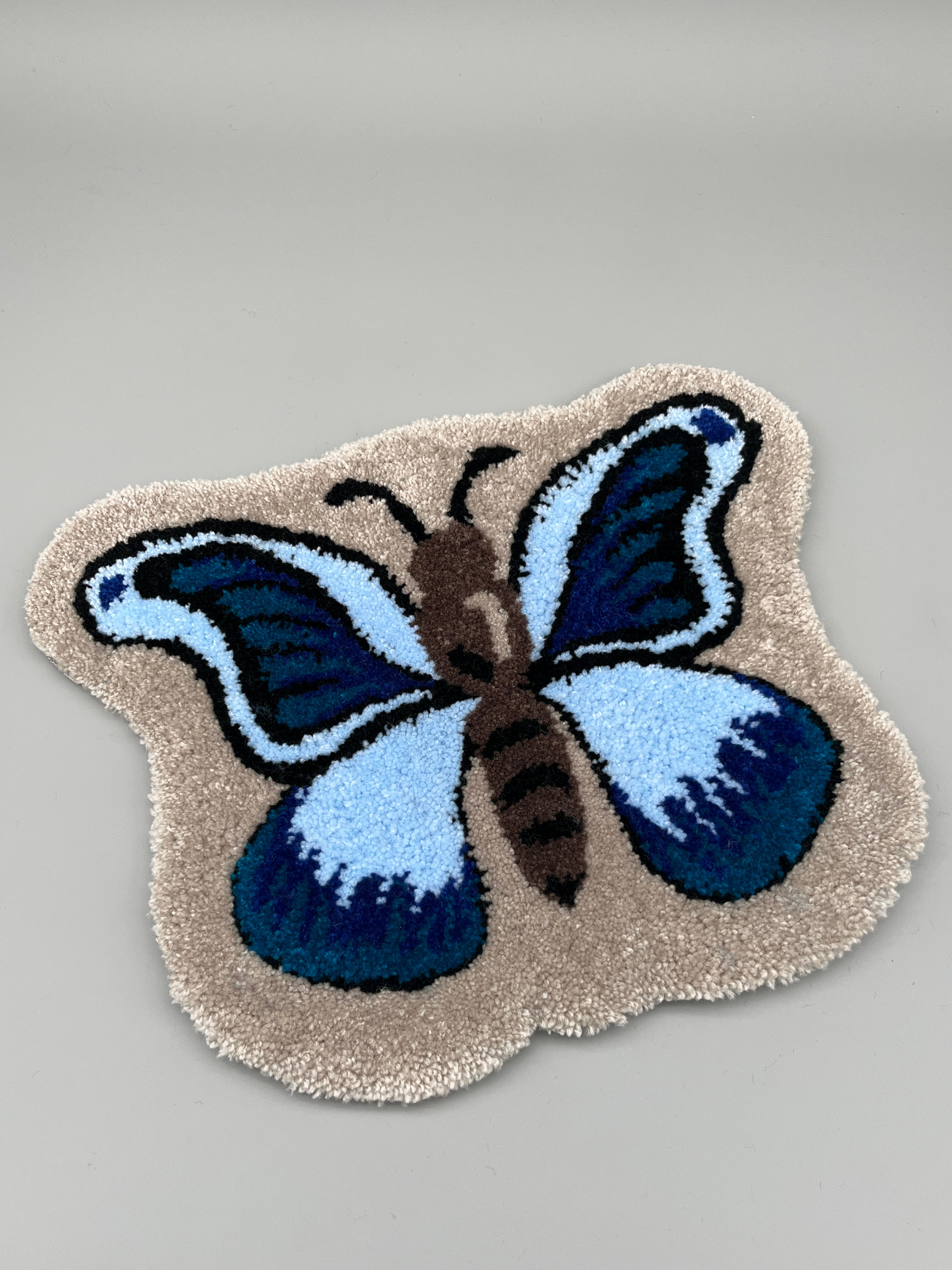 Handgefertigter Teppich, Schmetterling